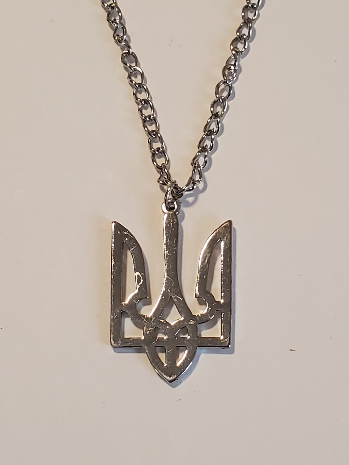 Coat of arms Trident on a chain