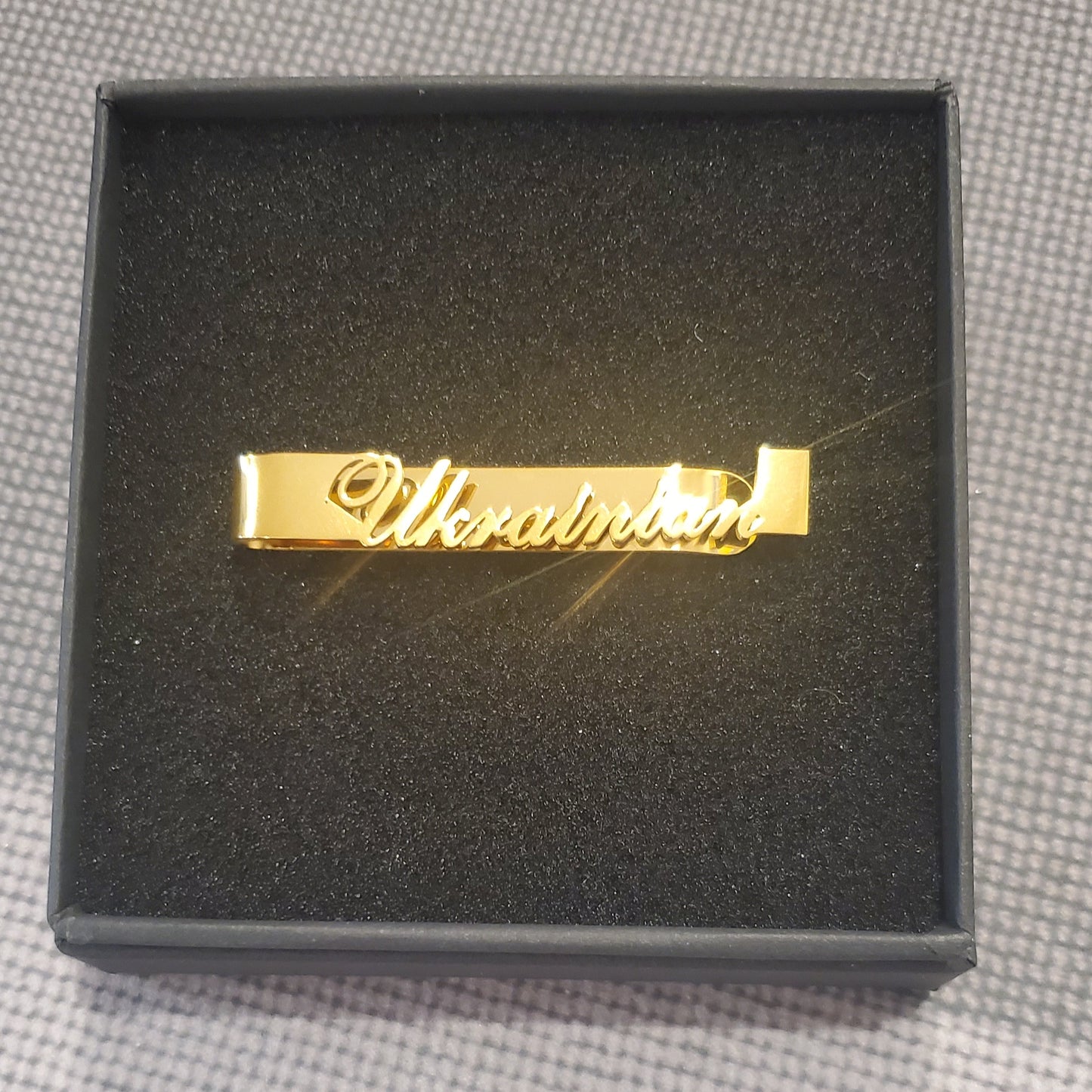 Tie clip holder