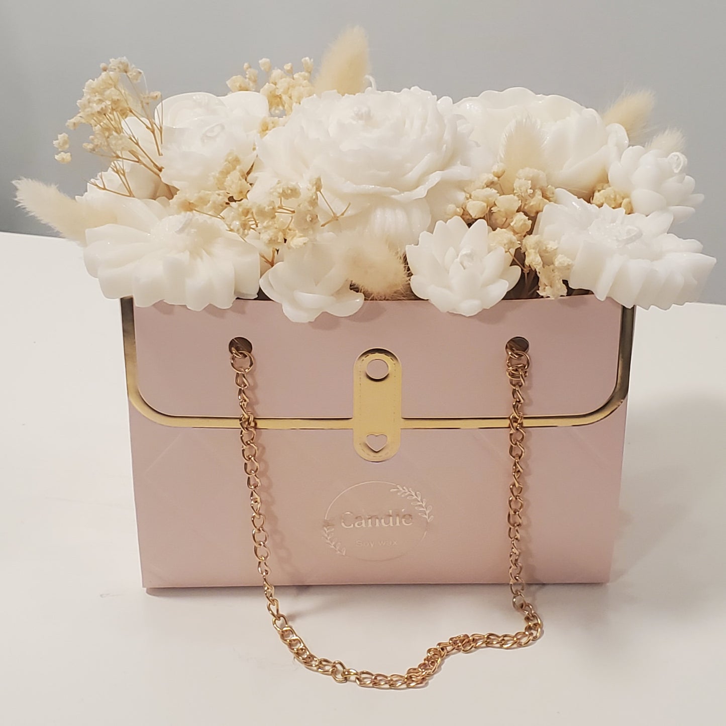 Candle bouquet of flowers in pink box