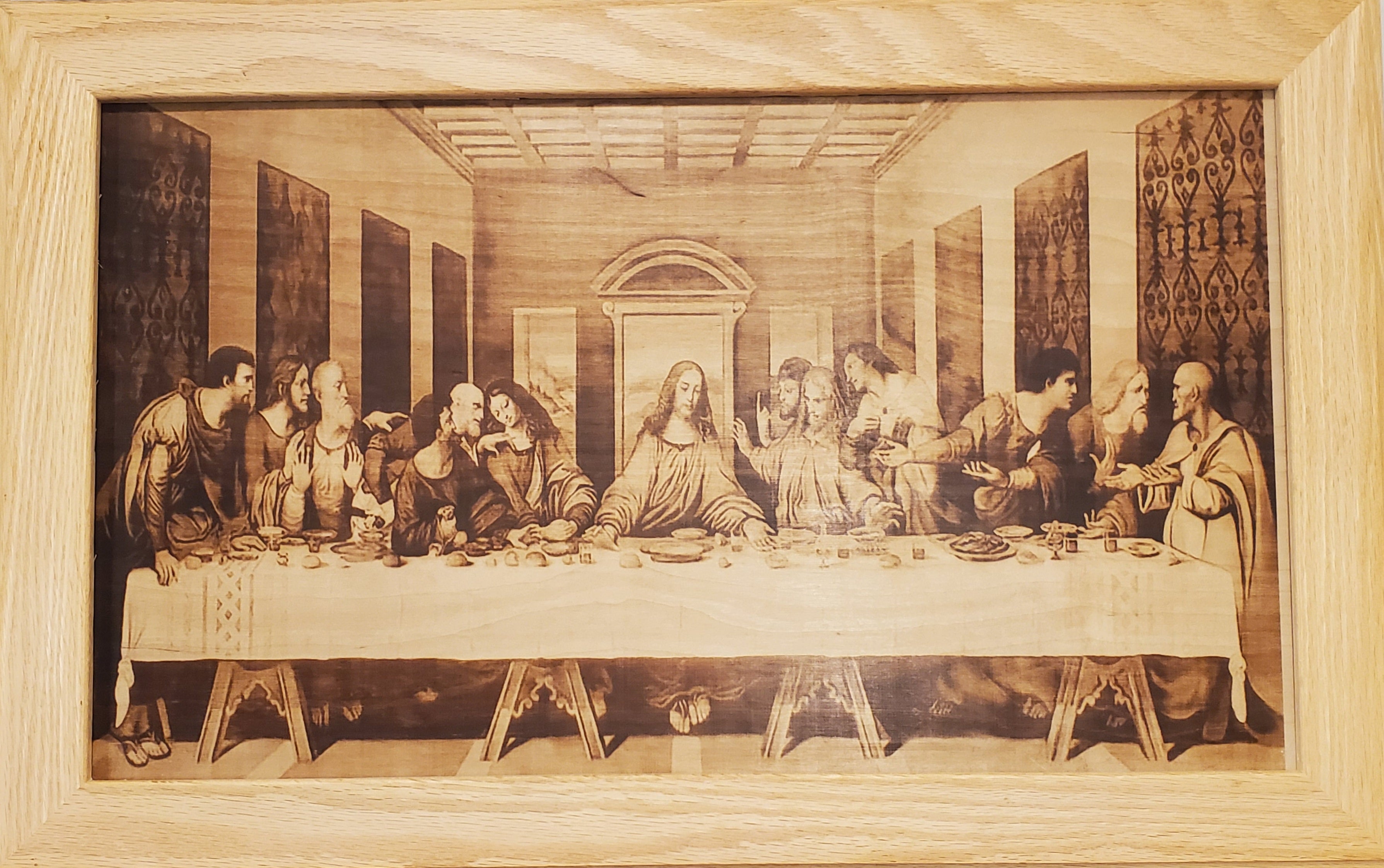Picture the Art of burn in a red oak frame