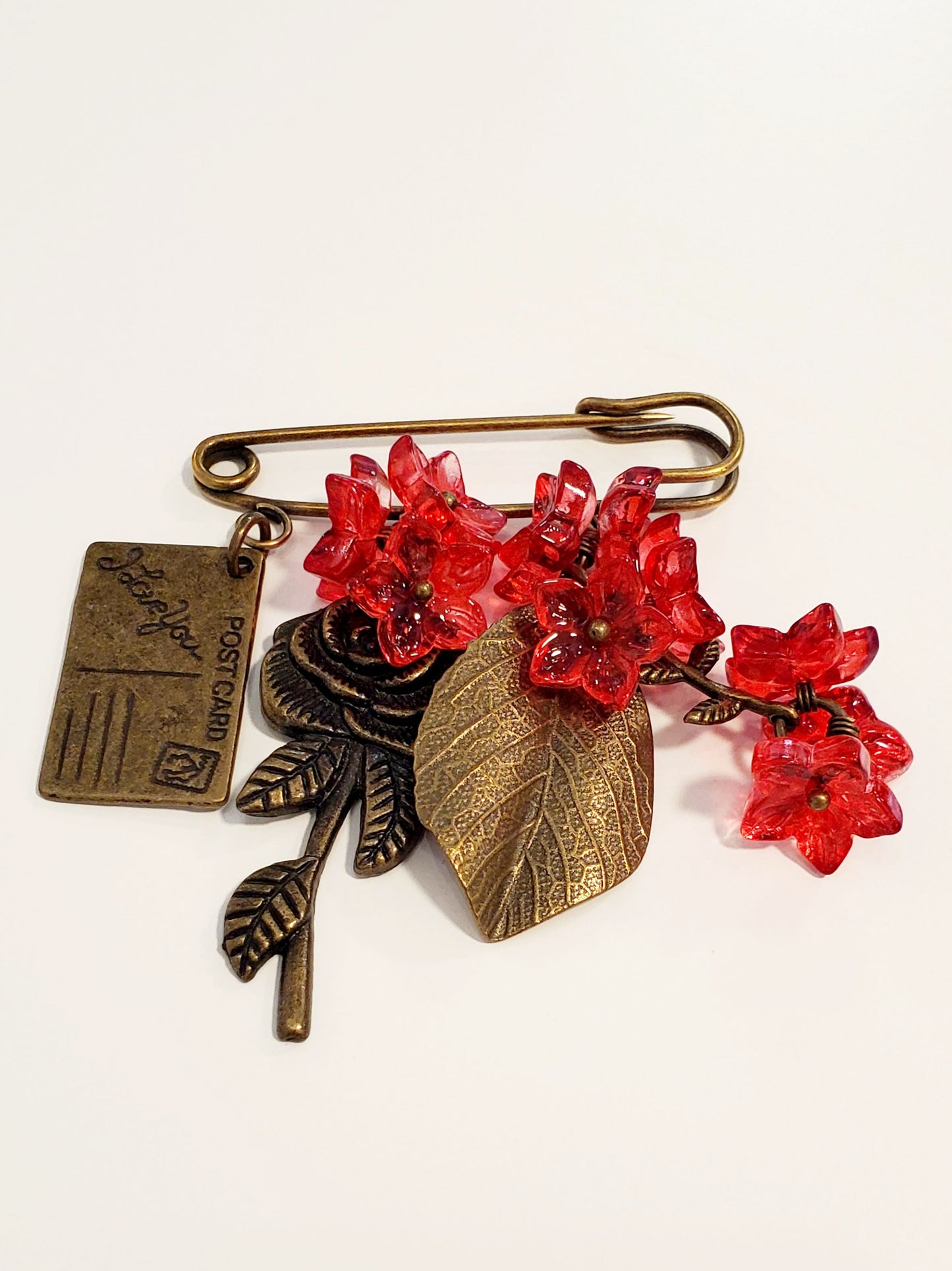 Brooch (glass, metal)