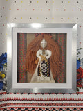 Motanka doll in frame