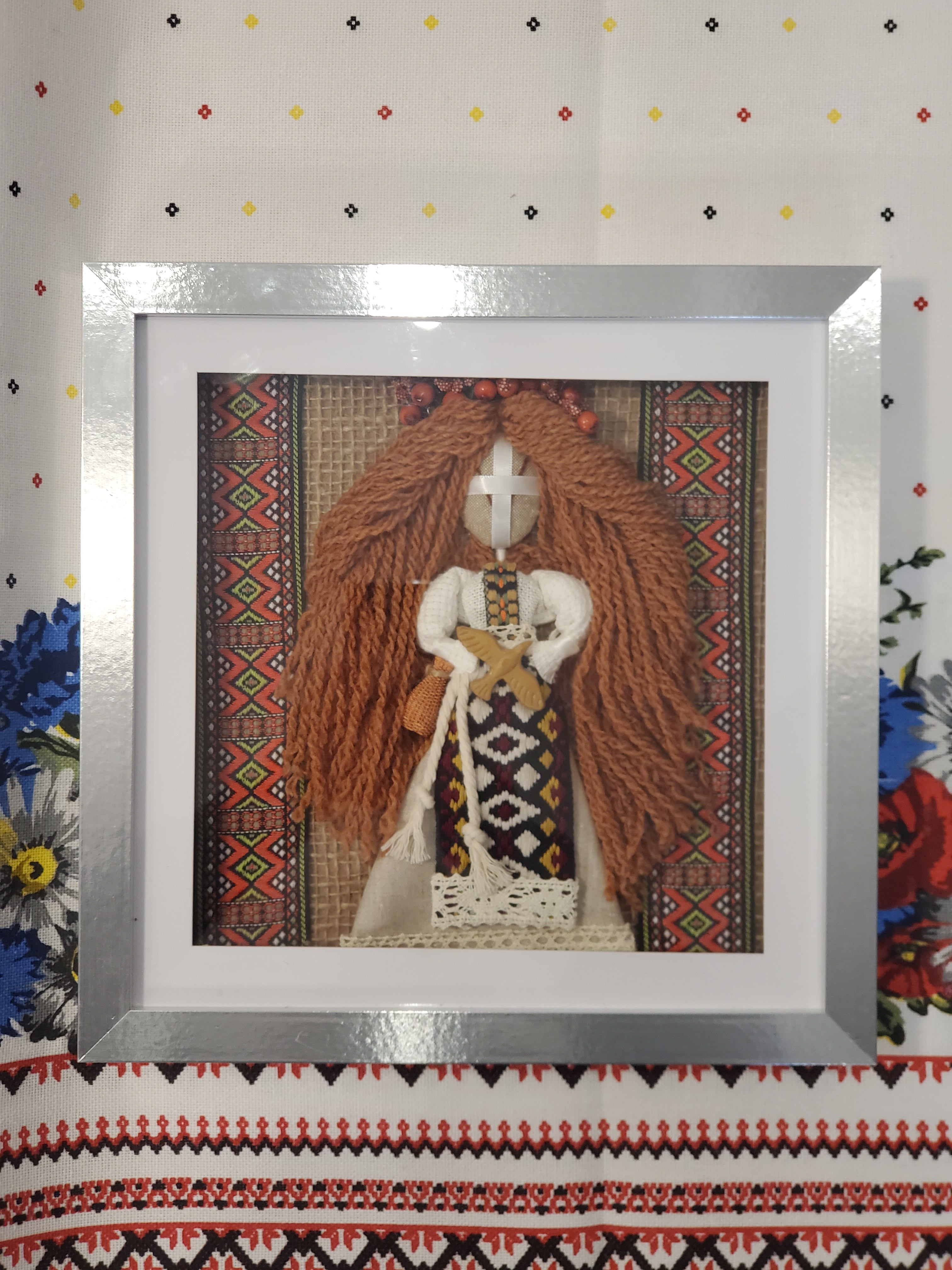Motanka doll in frame