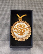 Wooden pendant on a rope with micro-embroidered name codes