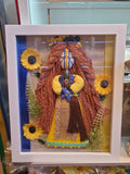 Motanka doll in frame