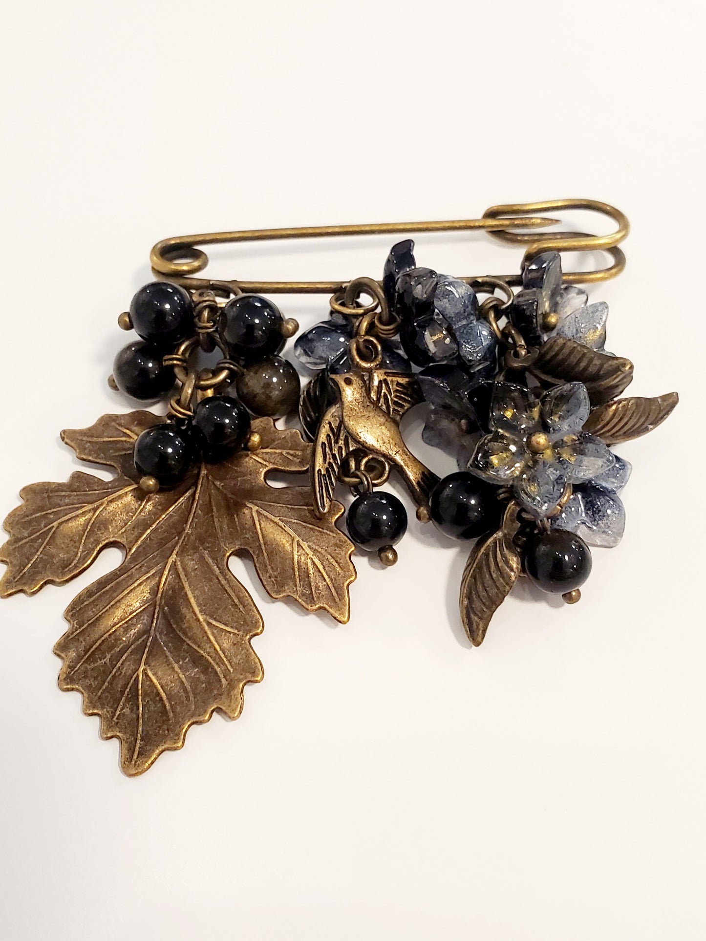 Brooch (glass, metal)